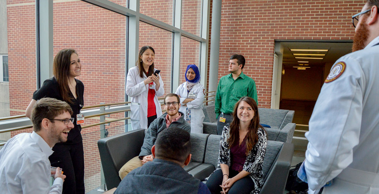 residents talking in the Rowan Medicine building