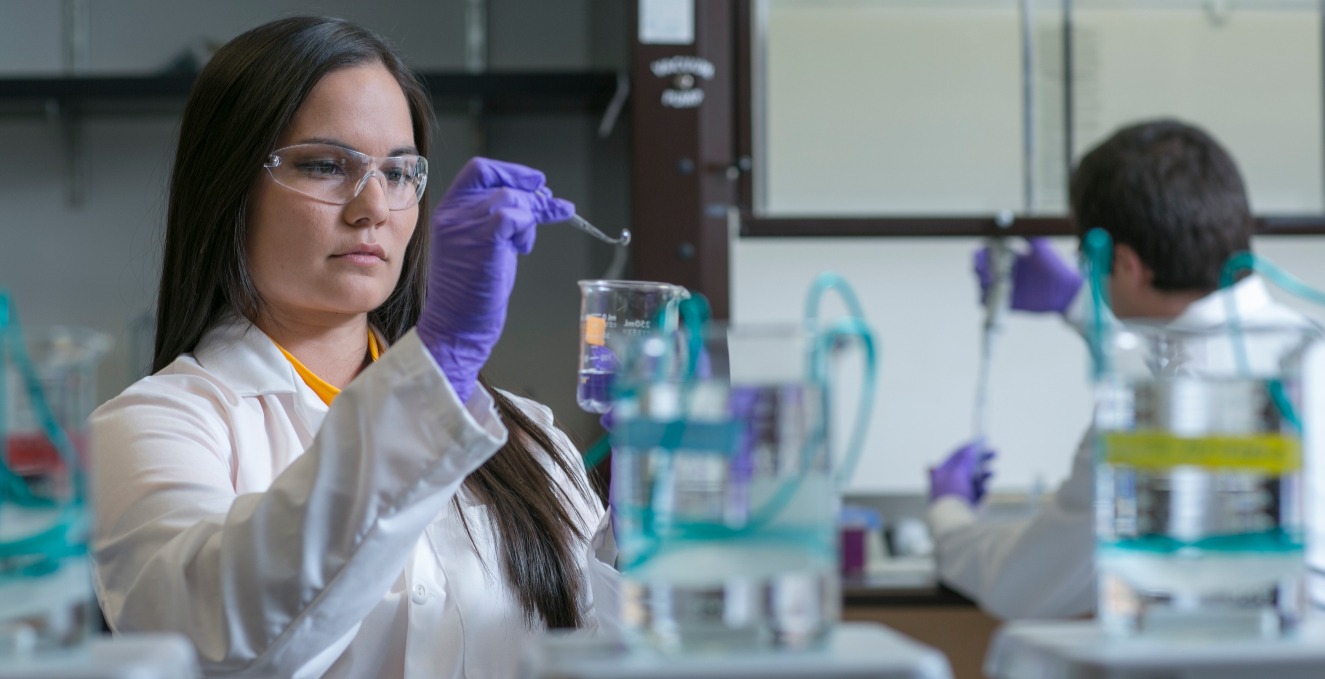 Researcher working with.a beaker