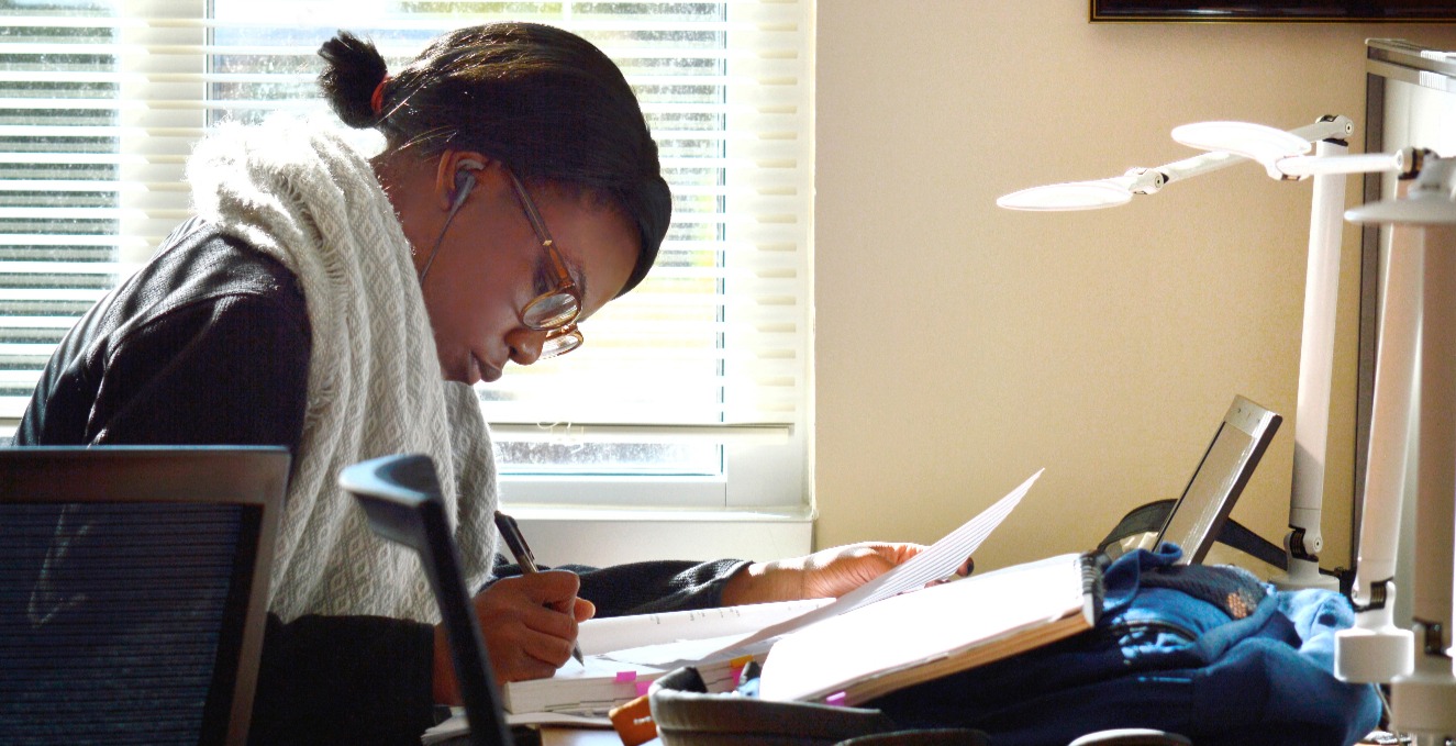 student studies in the library